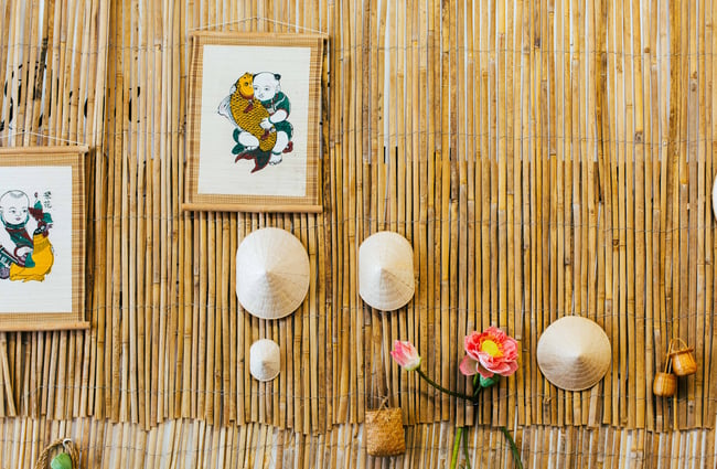 Wall hangings on bamboo wall at Saigon Noon.