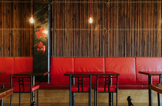 Red leather bench seating at Saikou, Timaru.
