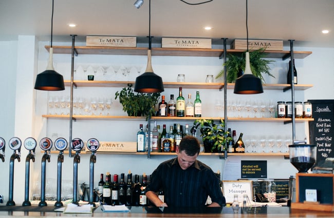 Behind the bar.