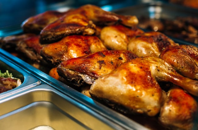 Chicken portions on a rack.