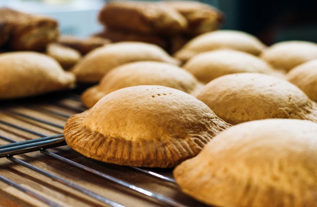 Baked pies on a rack.
