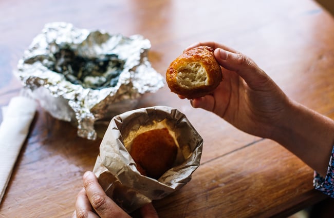 Eating Samoan food out of tin foil.