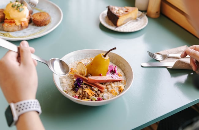 Eating oats with poached pear.
