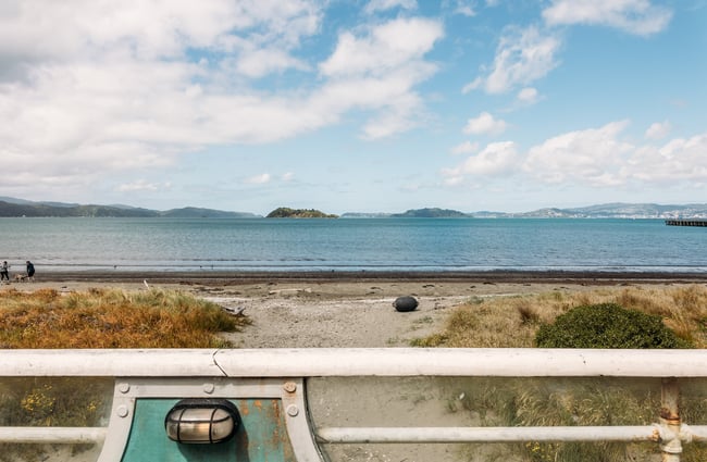 The view across the beach to the harbour and Wellington city beyond from Seashore Cabaret's deck area.