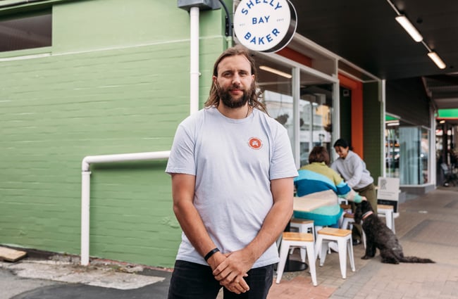 Owner outside Shelly Bay Baker on Karori Road.