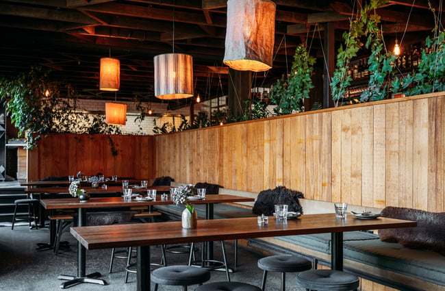 The wood and green interior of The Sherwood Queenstown.