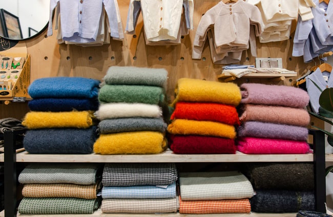 A stack of colourful scarves on display at Shopology.