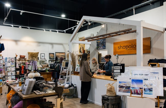 Customer at the front counter at Shopology.