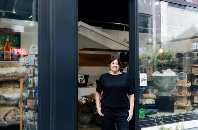 Shop owner Katie standing in the doorway of Shopology.