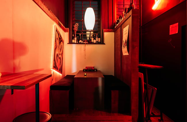 A dimly lit seating area inside Siduri Gisborne.