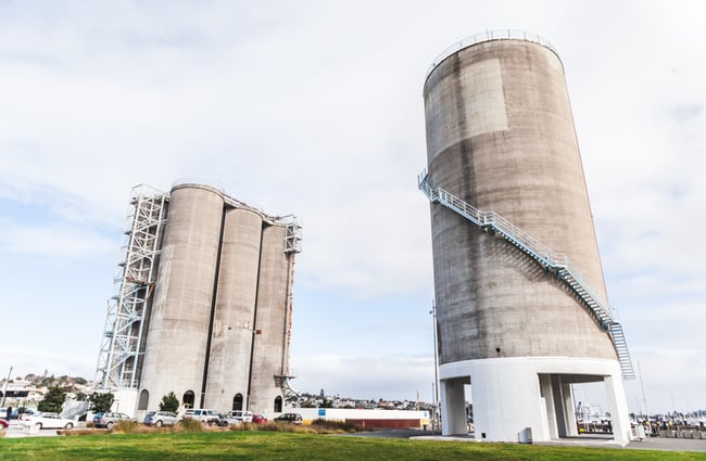Two silos outside.
