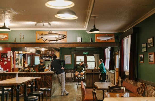 People standing in the bar at Silverstream Hotel, Kimbell.