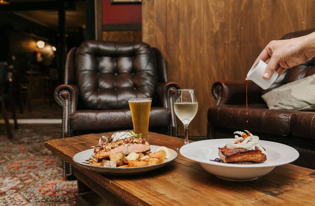 Two meals and drinks on the table at Silverstream Hotel, Kimbell.