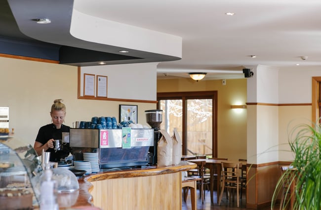 Barista making coffee at Sime's Kitchen.