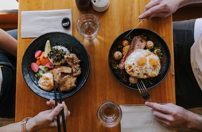 Birdseye view of couple eating meal at Sime's Kitchen.