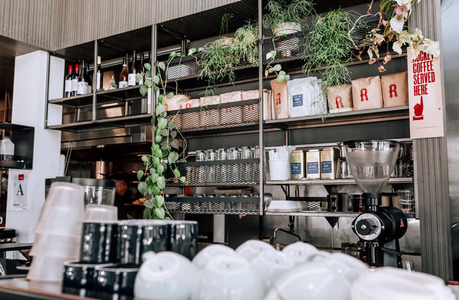Rocket coffee bean bags and cups on display at Simon and Lee, Auckland.