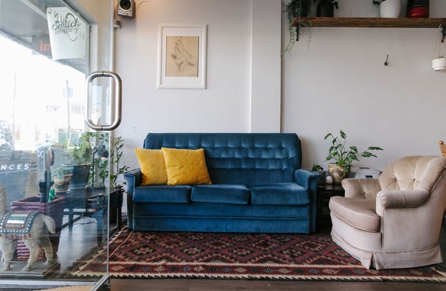 Vintage blue couch at Six Ounces.