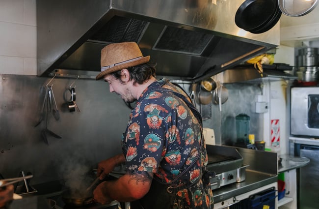 Chef cooking at Slam Club.