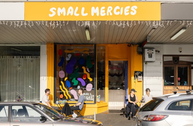 The yellow exterior of Small Mercies Auckland.