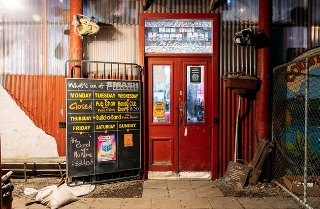 The red doors leading into Smash Palace bar Gisborne.