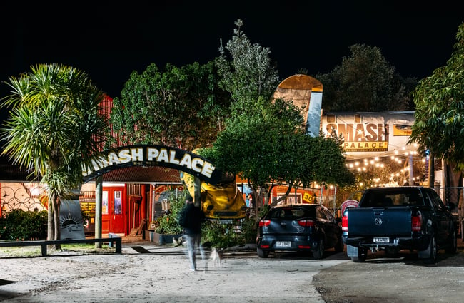 The exterior of Smash Palace Gisborne at night.