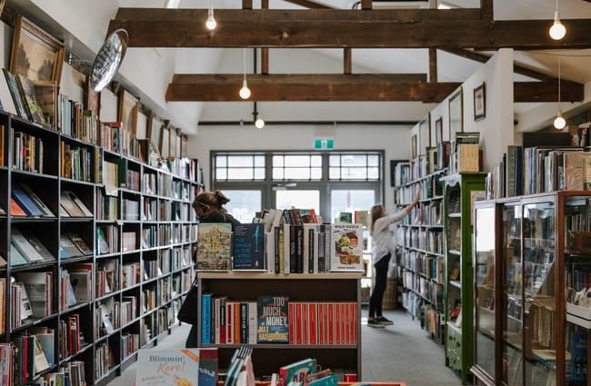 Interior view of the bookstore with customers.