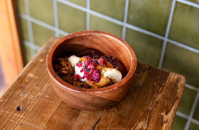 A close up of a smoothie bowl on a table.