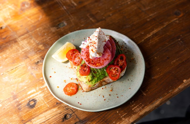 Avocado on toast on a table.