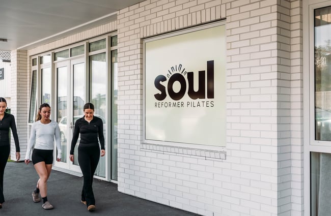 Customers walking on the footpath outside the building of Soul Pilates.