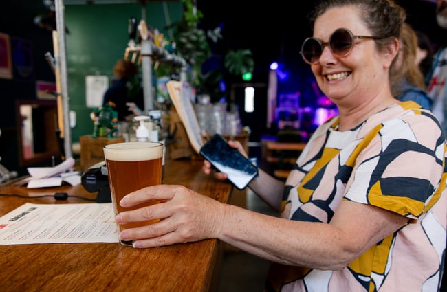 Customer enjoying a beer at Space Academy.