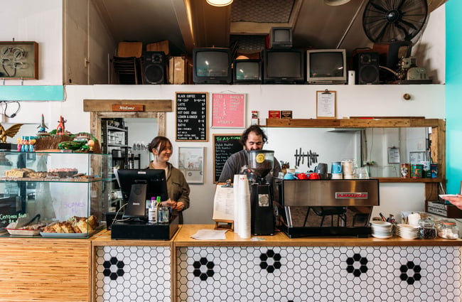 Baristas behind the counter at Space Cadet, Hamilton.