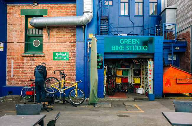 A dark blue building used as a bike studio.