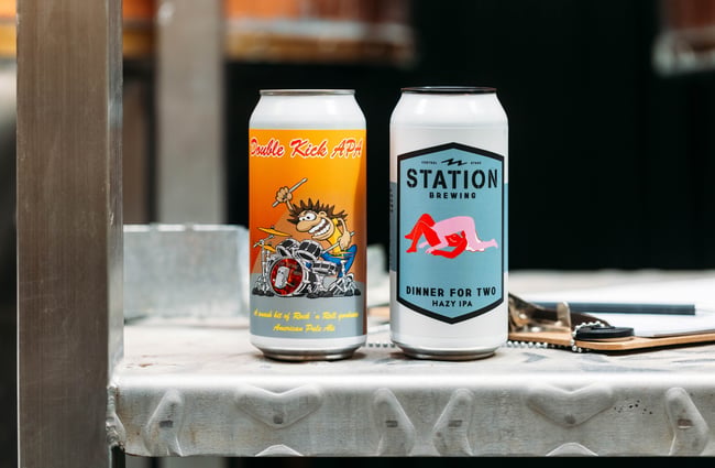 A close up of two beer cans.