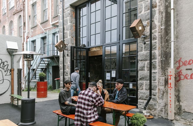 People sitting outside Steamer Basin having a beer.