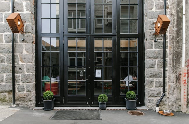 The black doors leading to Steamer Basin in Dunedin.