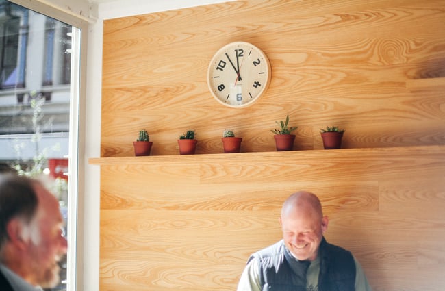 A clock and plants.