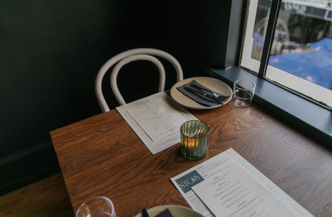 A table laid for for two at Story.