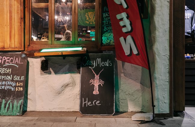 Backboard outside Strawberry Tree with a crayfish drawn on it.