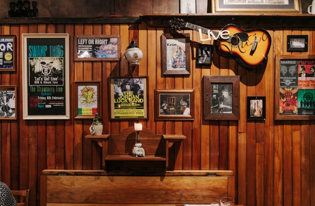 Band posters framed on the wall at Strawberry Tree.