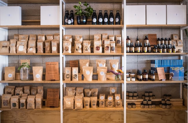 Shelving with items wrapped in brown packaging.