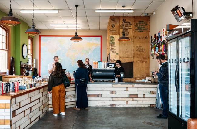 Customers ordering at the front counter at Sublime Coffee Roasters.