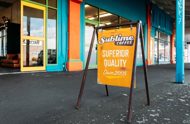 A sign is on the footpath outside the front door of Sublime Coffee Roasters.