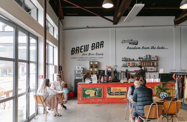 Customers enjoying coffee at Sublime Roastery and Brew Bar.
