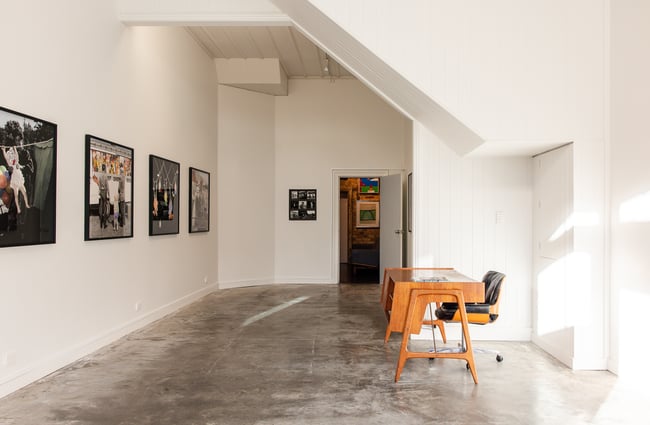 Stark gallery room with concrete floor