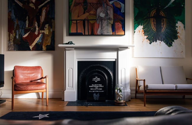Fireplace with satirical memorial engraving