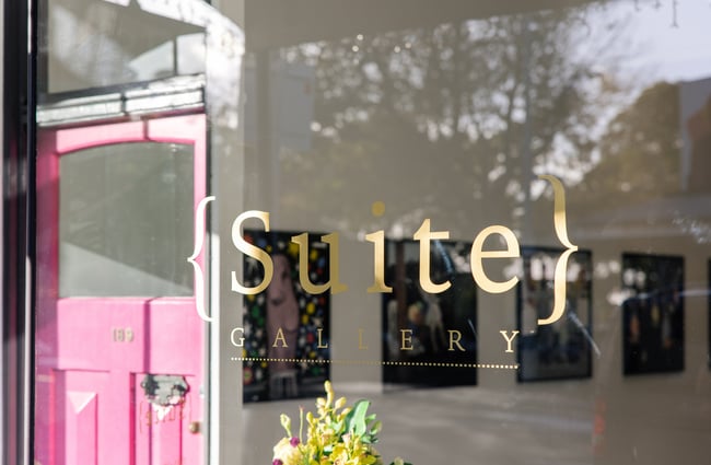 Close up of gold signage at Suite Gallery in Auckland
