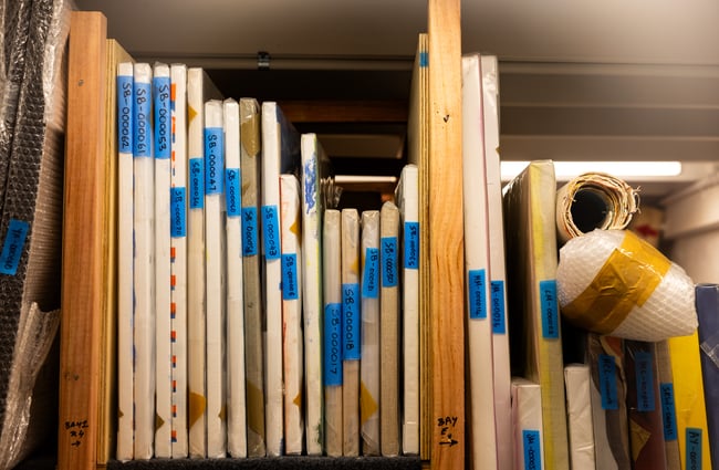 A close up of works of art covered in tape.