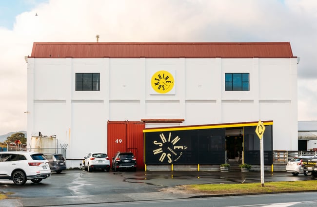 The white exterior of The Sunshine Brewery Gisborne.
