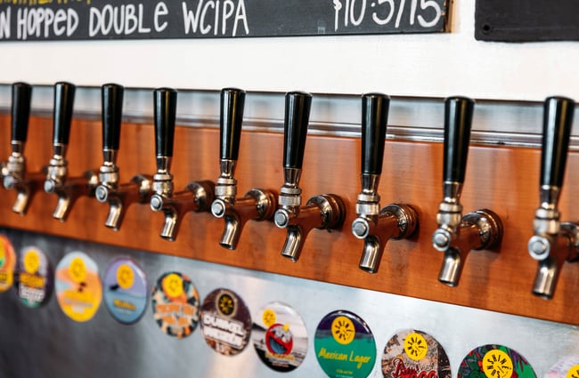 A close up of beer taps.
