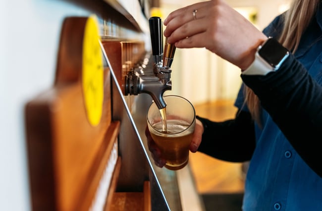 Beer being pulled into a pint glass.